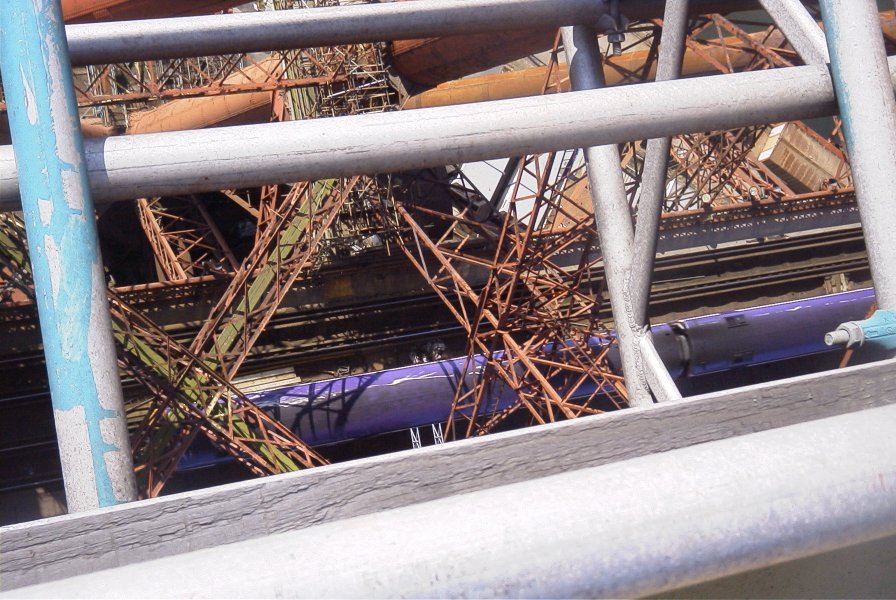 [image] looking down through the steelwork at the tracks and sea below