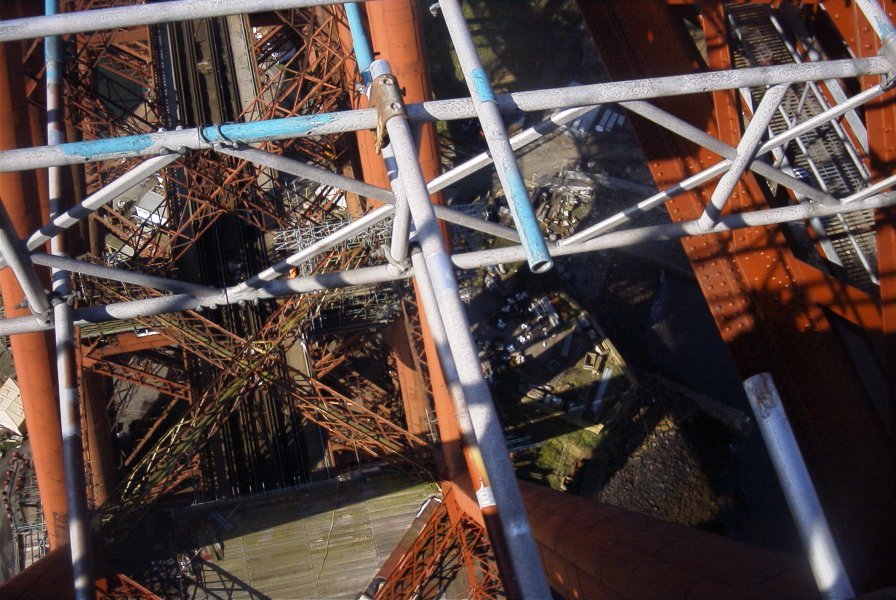 [image] looking down through scaffolding and steelwork at the running lines